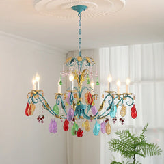 Close-up of a gold floral fruit crystal chandelier showcasing its intricate metalwork and vibrant, multi-colored glass fruit embellishments.