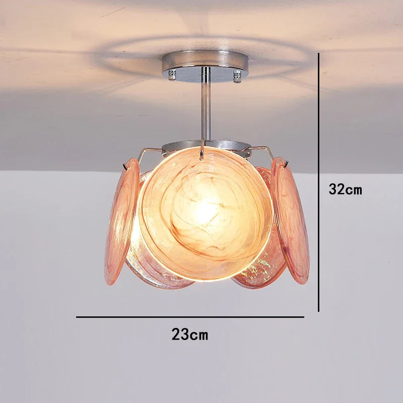 Ceiling light fixture with glass shades and measurements on a plain background