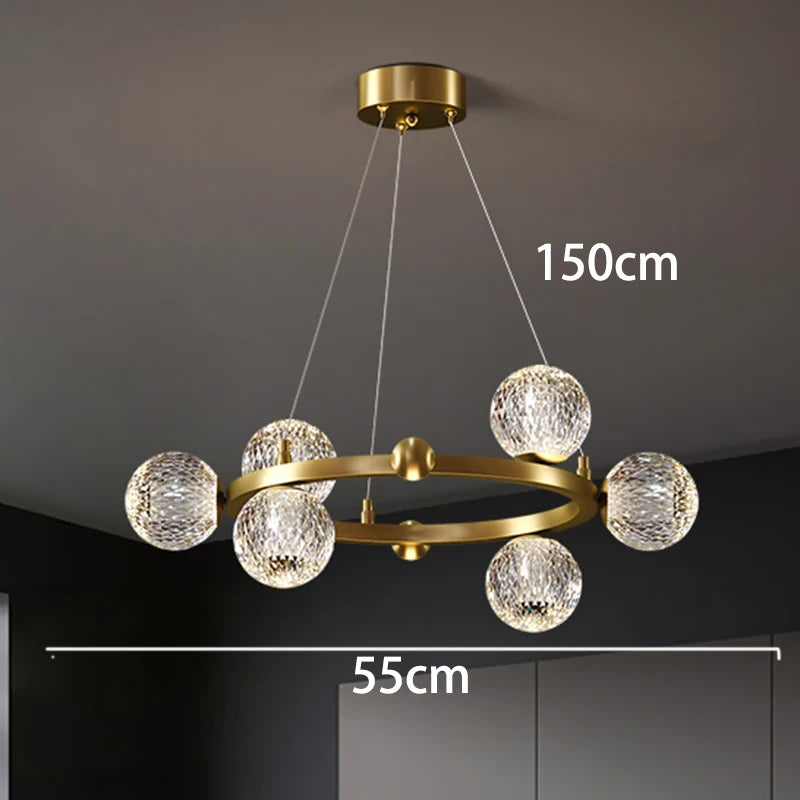 Gold chandelier with crystal balls, shown against a dark background with measurements indicated.