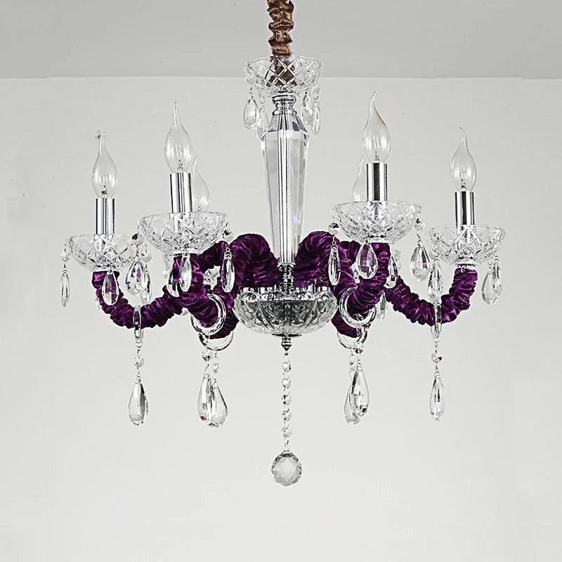A regal 6-head chandelier in a deep purple hue, adorned with faceted crystals and a polished chrome central column.