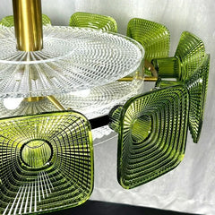Detailed view of the green glass square accents and the central clear glass element of the chandelier.