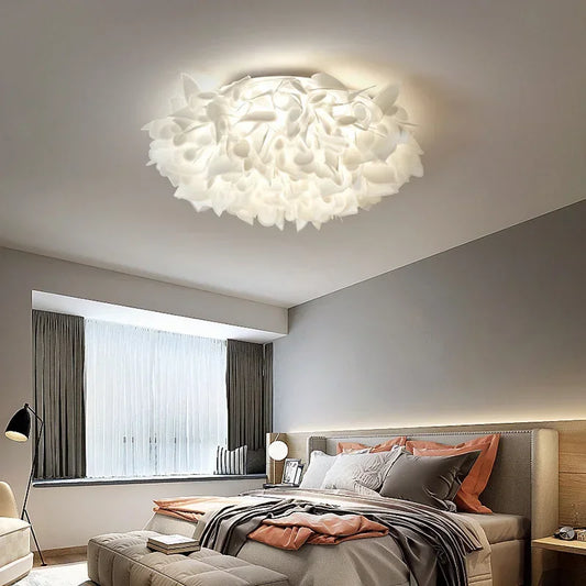 White petal-shaped flush mount ceiling light in a modern bedroom setting.