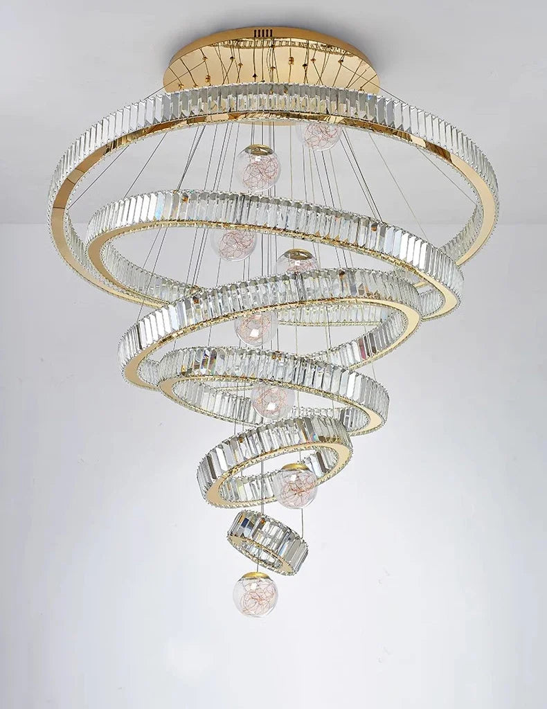 Chandelier with spiral design and gold accents on a white background