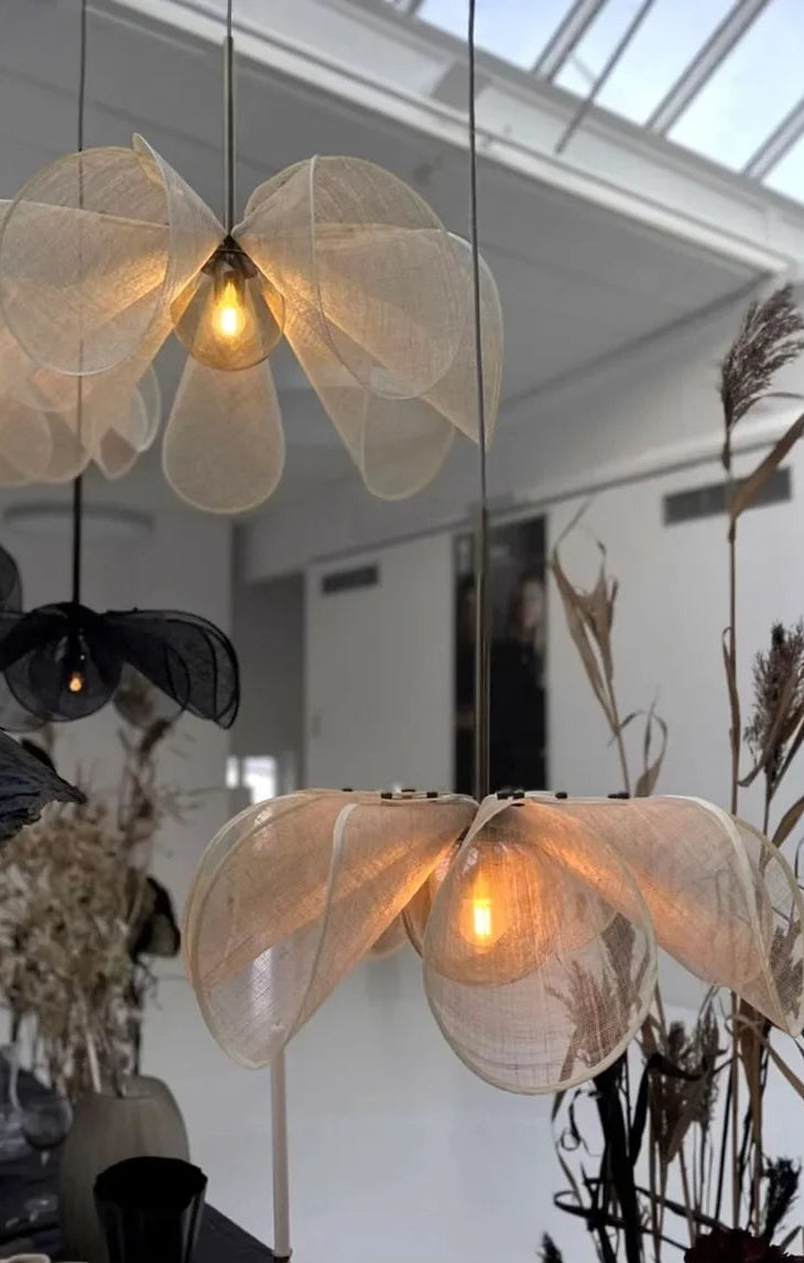 Decorative pendant lights with a floral design in a modern interior setting.