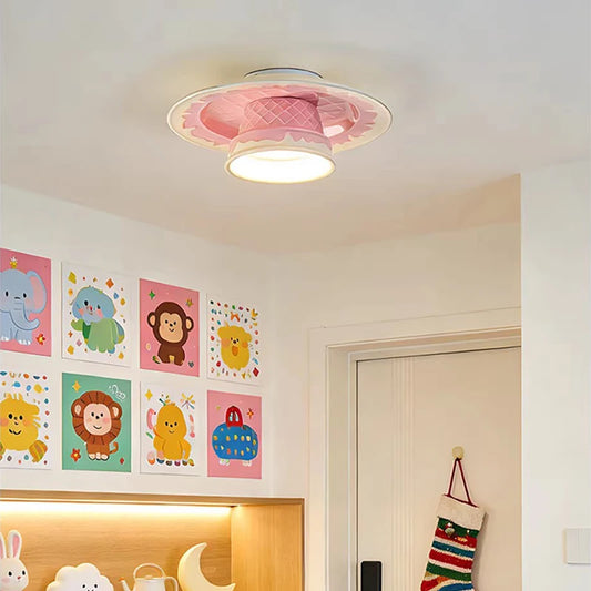A pink ceramic coffee cup shaped ceiling light installed in a room with colorful animal art on the walls.