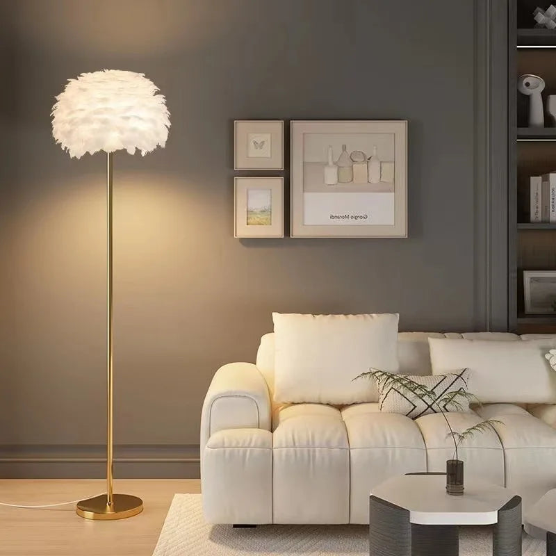 Modern living room with a beige sofa, floor lamp, and wall art.