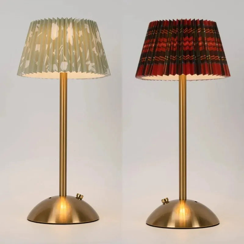Two table lamps with pleated lampshades on a light gray background