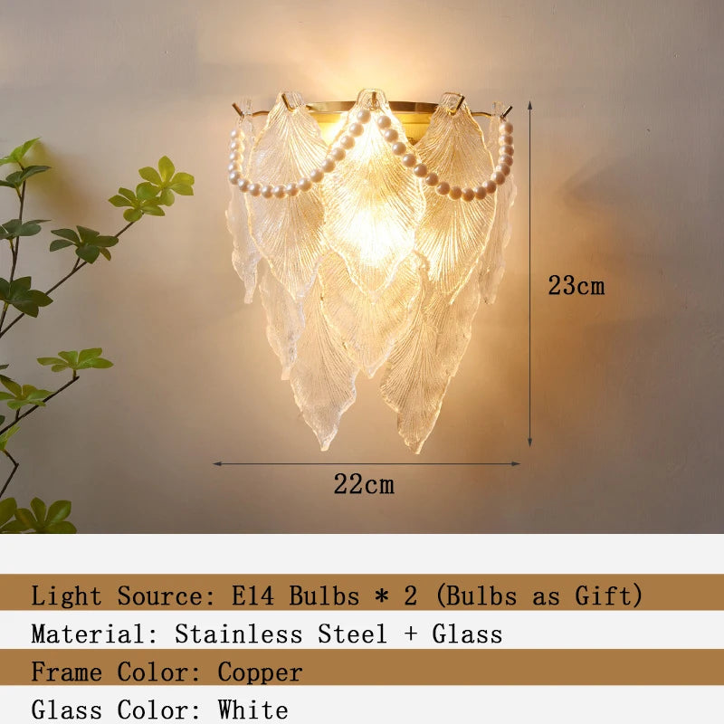 Decorative wall light fixture with leaf design on a neutral background