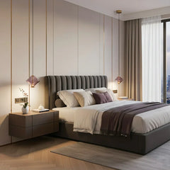 Close-up of a pendant light with a unique purple glass shade and brushed gold accents in a bedroom setting.