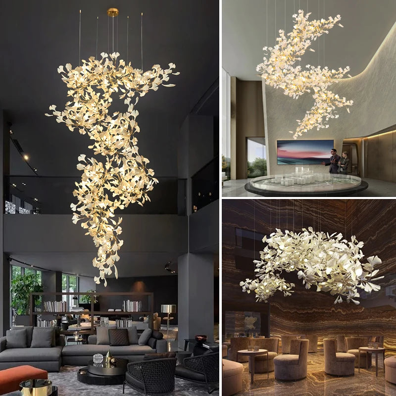 Gold ginkgo leaf chandelier with cascading branches, illuminated, in a modern living room.