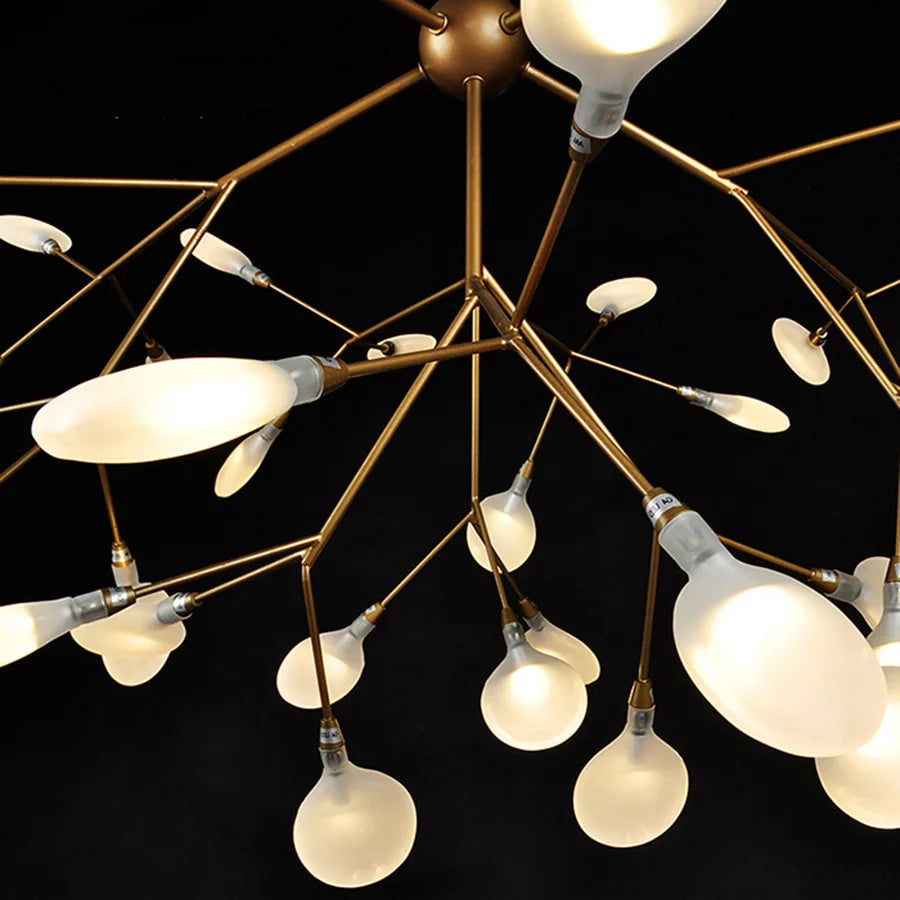 Modern chandelier with multiple light bulbs on a black background