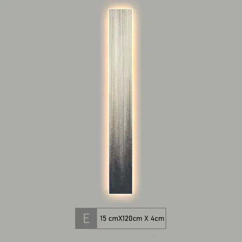 Wall-mounted light fixture with a gradient design on a gray background