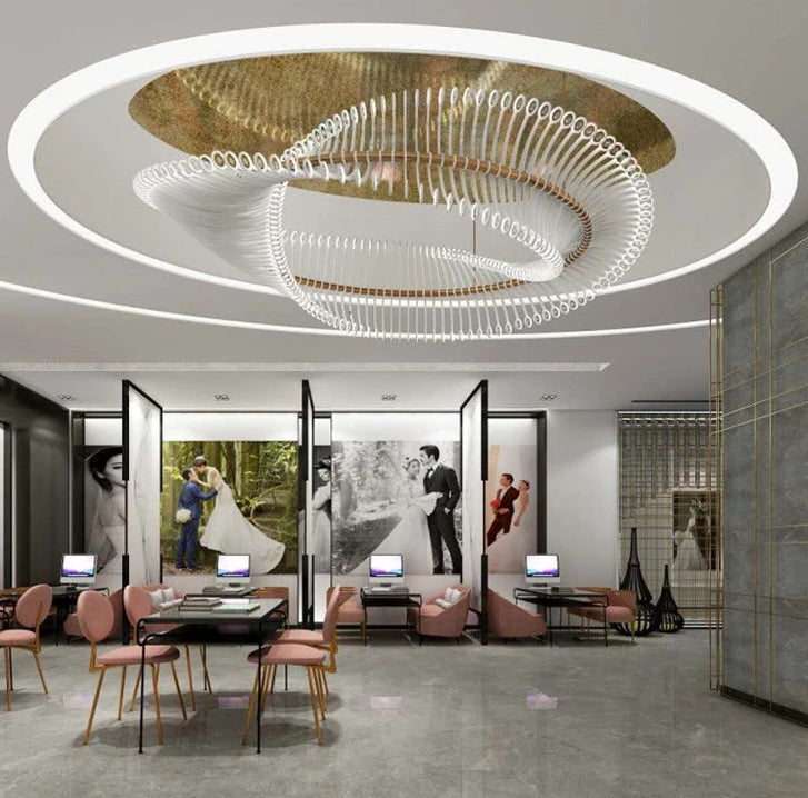 Modern interior design with a chandelier, chairs, and tables.