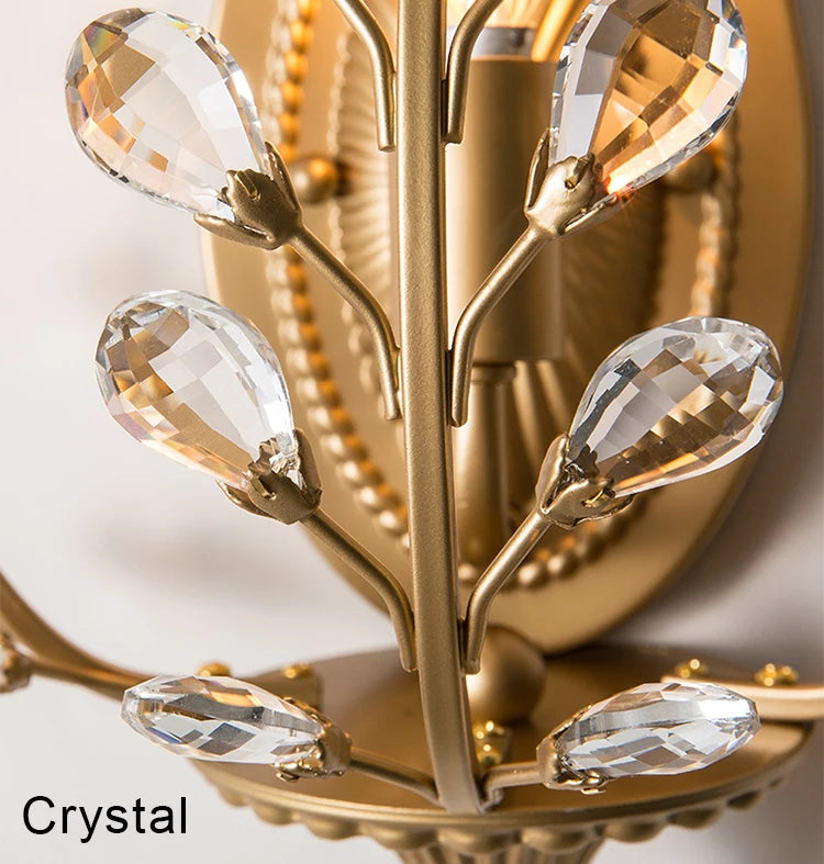 Gold chandelier with crystal elements on a white background