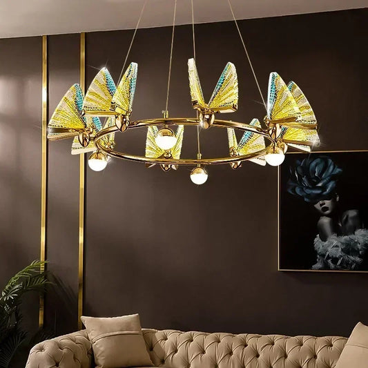 Close-up of a gold ring chandelier with translucent yellow and blue butterfly-shaped shades.