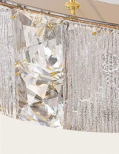 Close-up of a decorative wall piece with crystal-like stones and metallic accents.