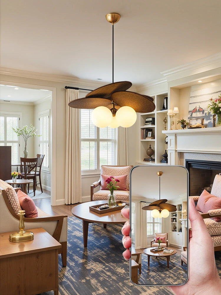 Living room with a modern ceiling fan and decorative elements.