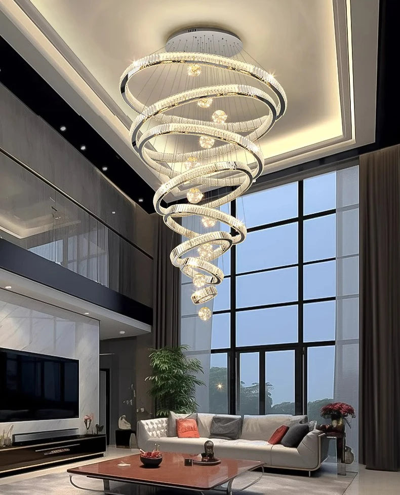 Modern spiral chandelier in a living room with large windows