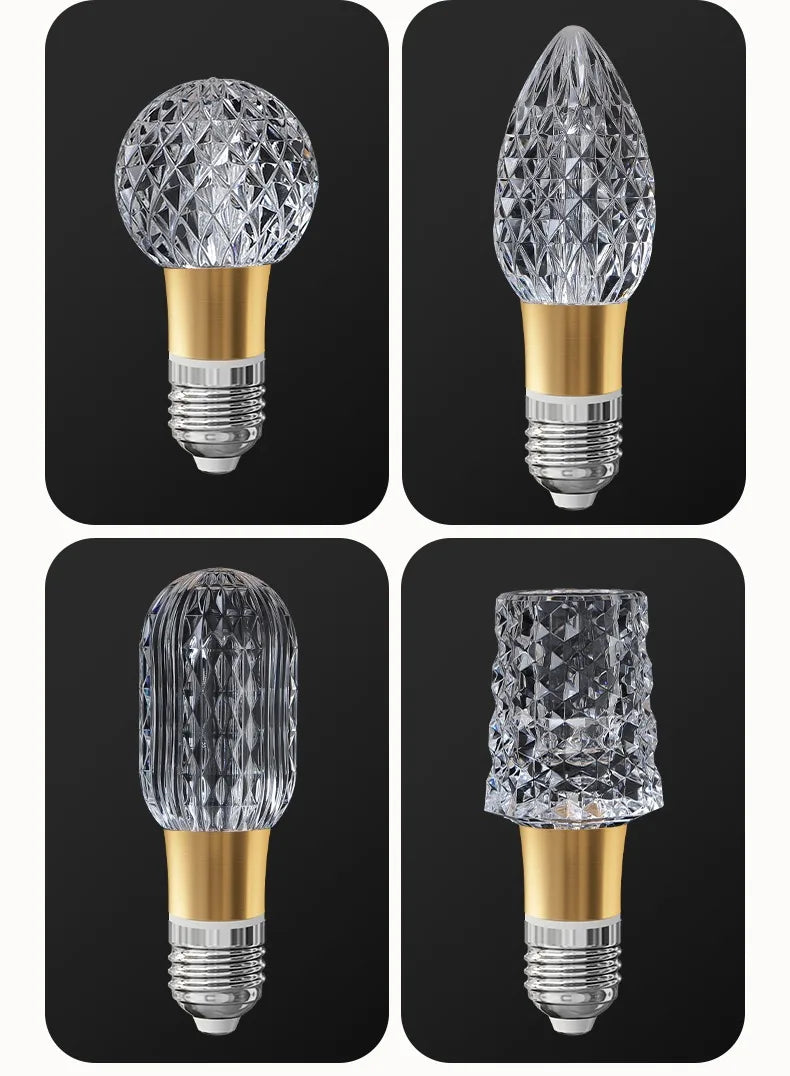Four crystal light bulbs on a black background