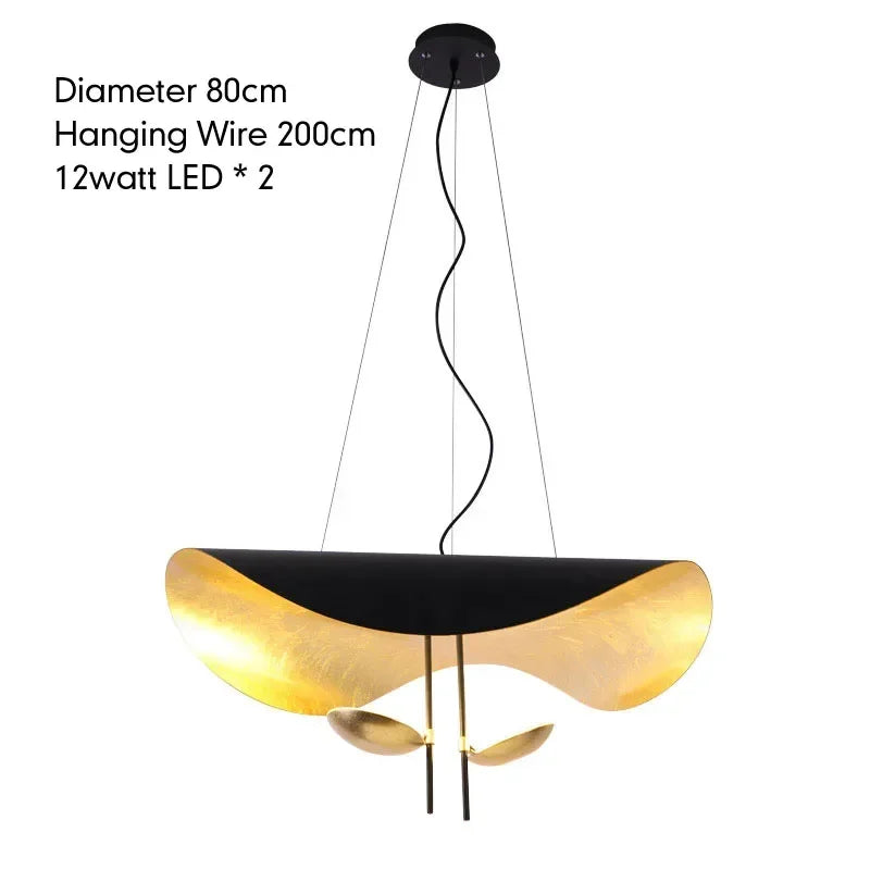 Modern pendant light with black and gold design on a white background