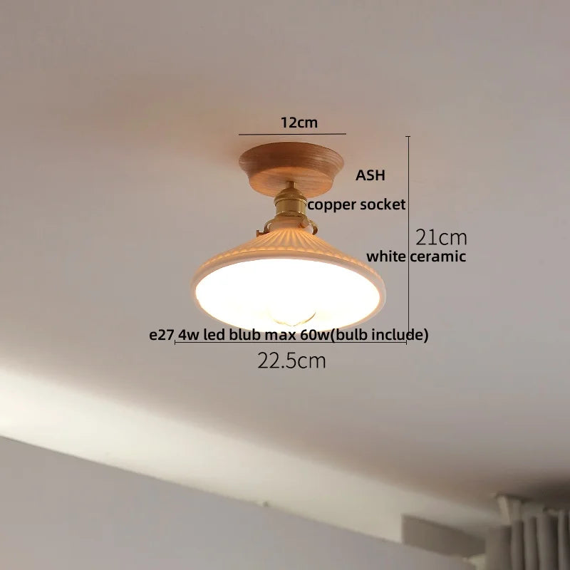 Ceiling light fixture with dimensions labeled on a plain ceiling.