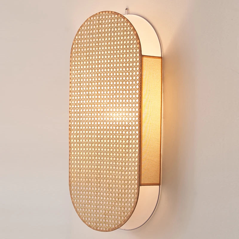 Woven wall light fixture on a plain wall
