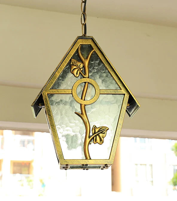 Decorative hanging light fixture with floral design on a blurred background
