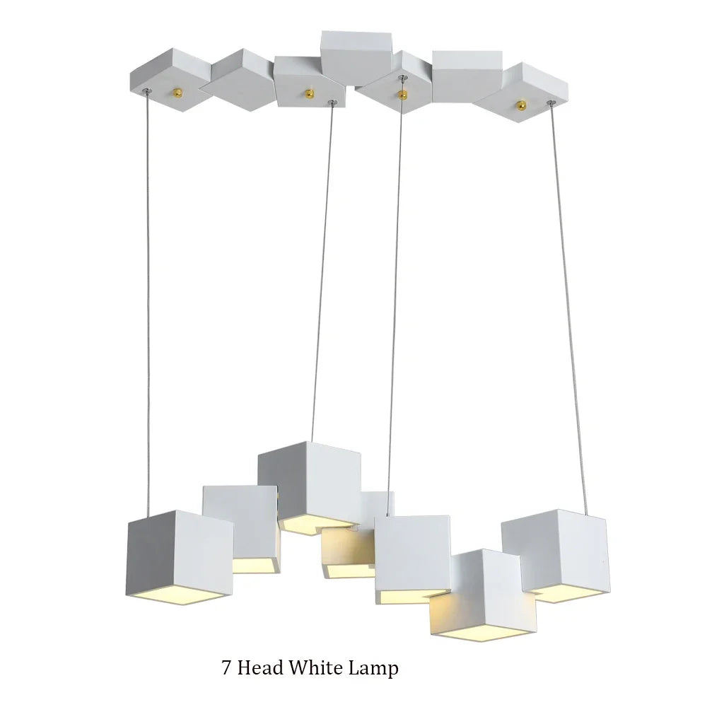 Modern white pendant lamp with seven square shades on a white background