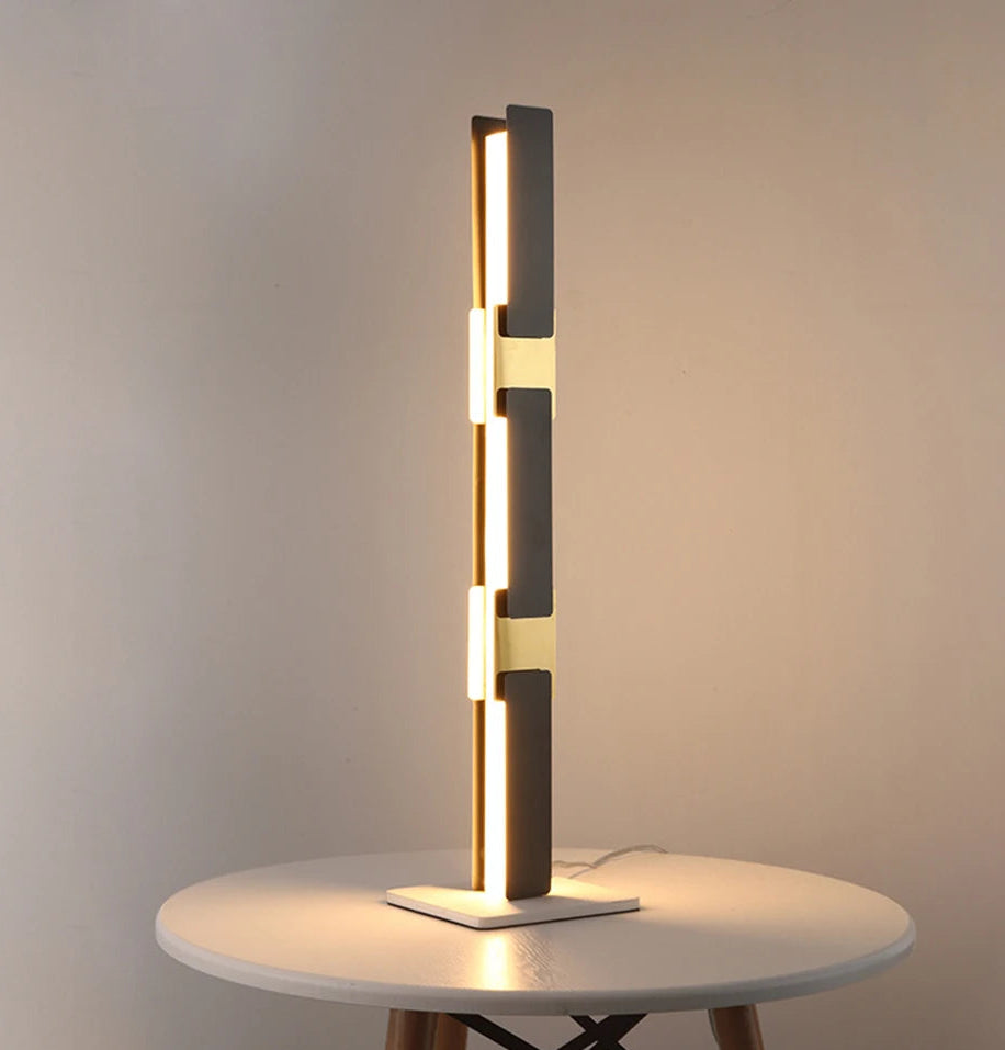 Modern table lamp on a round white table with a neutral background
