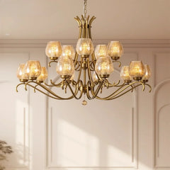 A six-light gold chandelier with seeded glass shades, showcasing its intricate arm design.