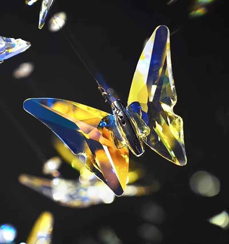 Crystal butterfly ornament with multicolored wings on a dark background
