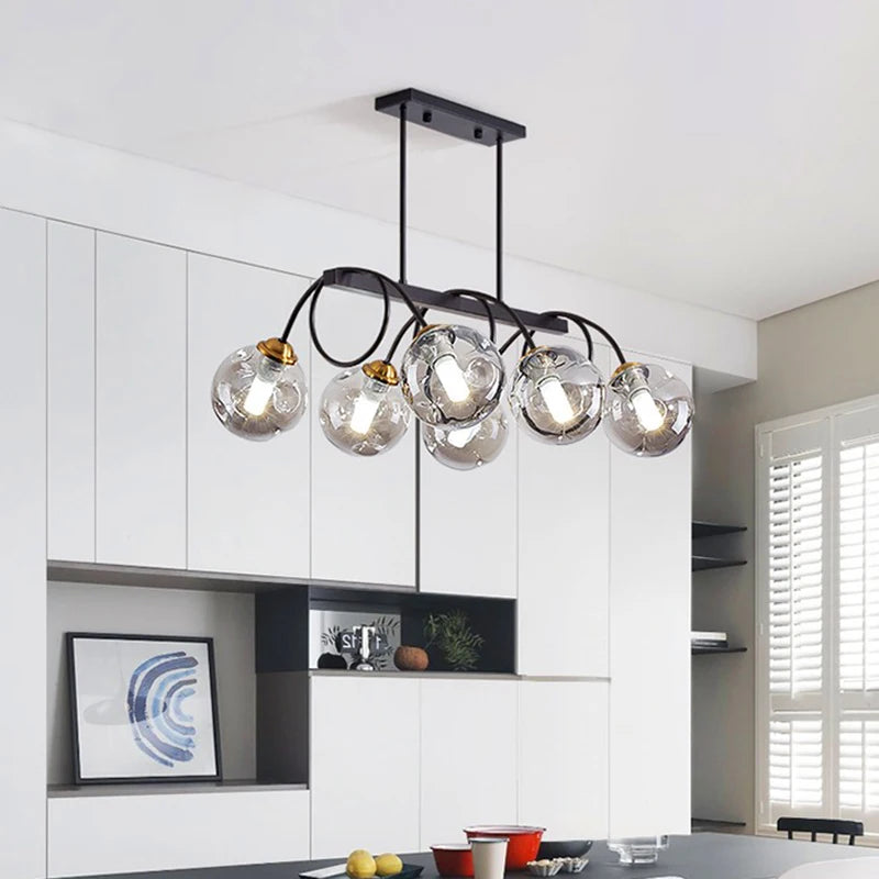 Modern chandelier with glass shades in a kitchen setting