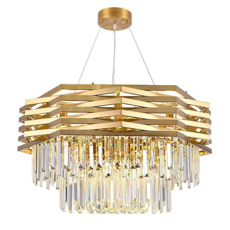 Gold chandelier with crystal accents on a white background