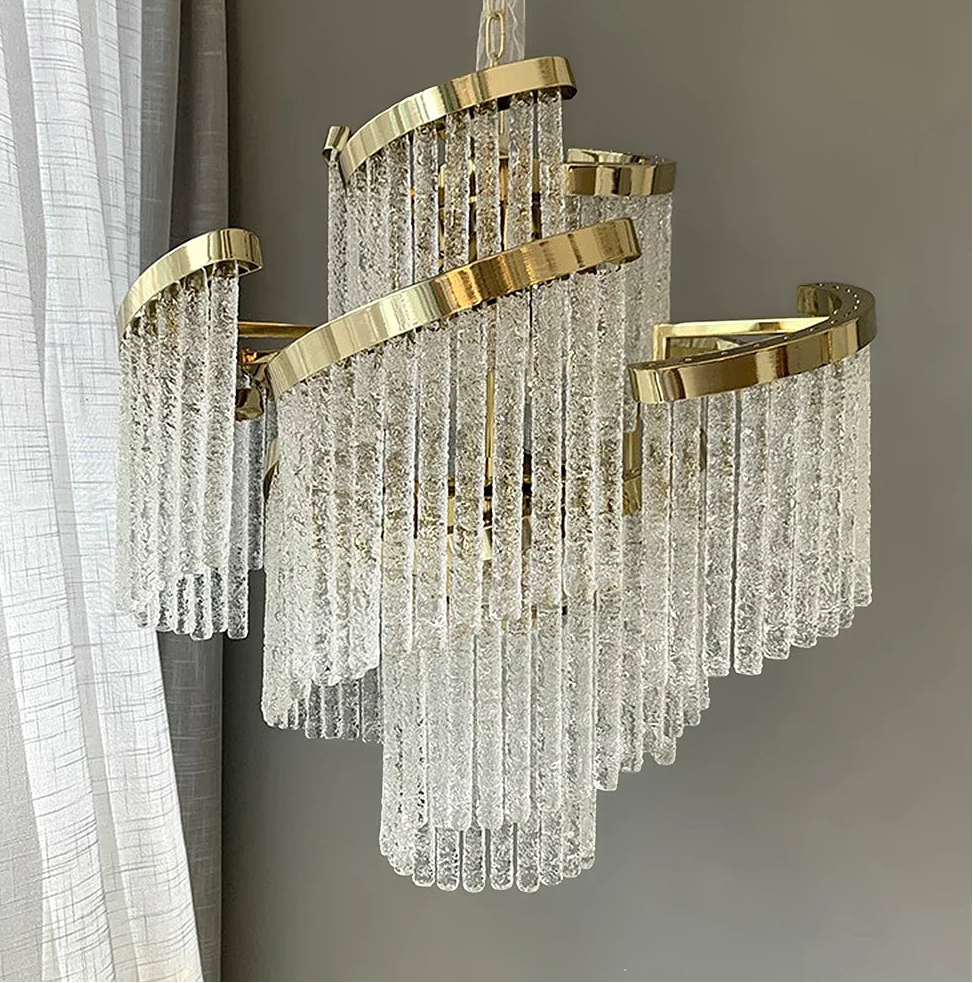 Gold and crystal chandelier against a neutral background