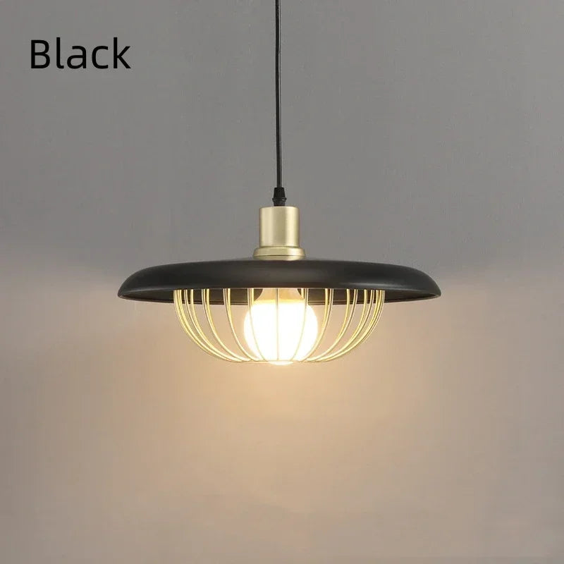 Black pendant light with a lit bulb on a gray background