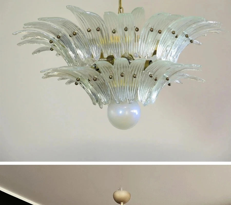 Decorative chandelier with glass shades on a plain background