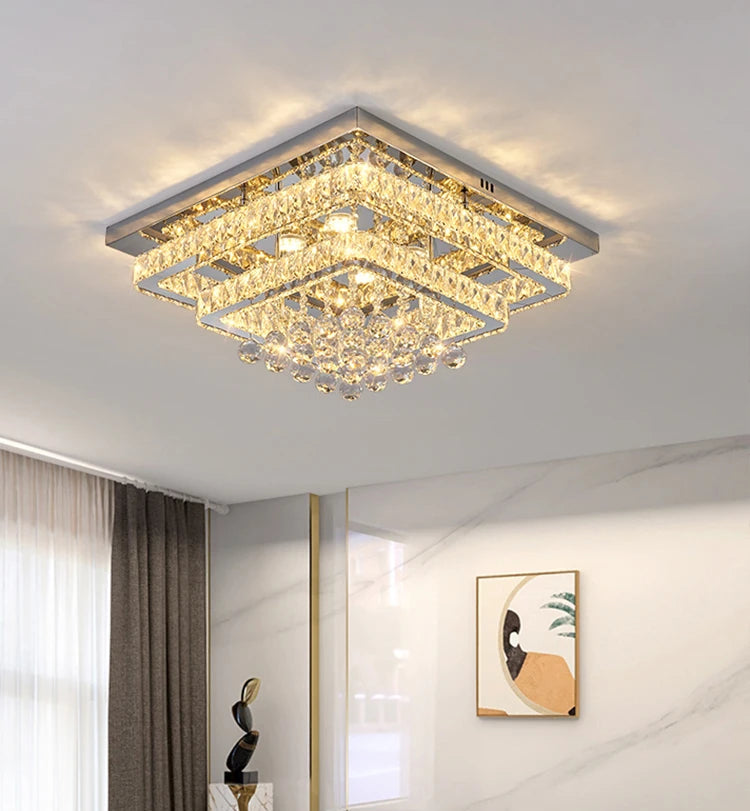 Modern square ceiling light fixture in a room setting with decor elements.