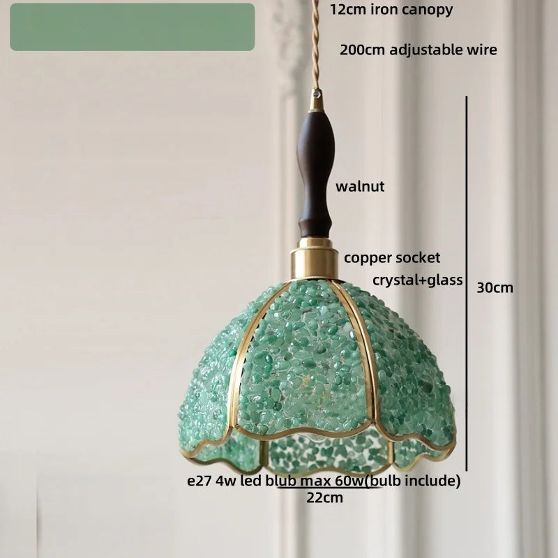 Green pendant light with labeled parts on a neutral background