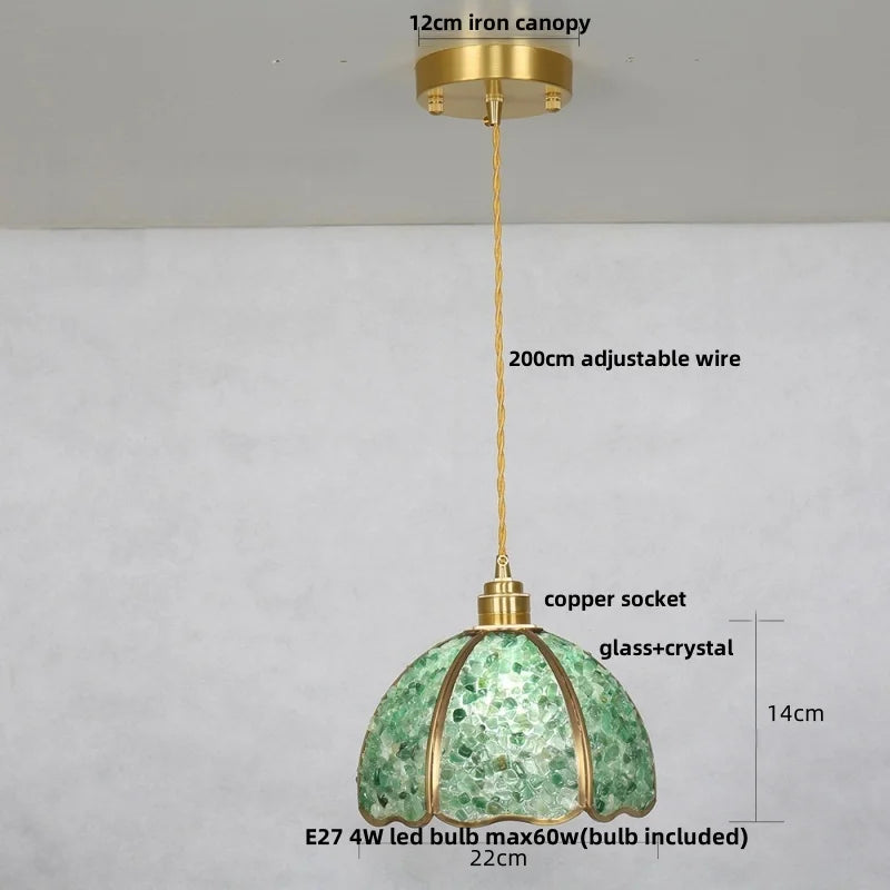 Green pendant light with measurements on a gray background