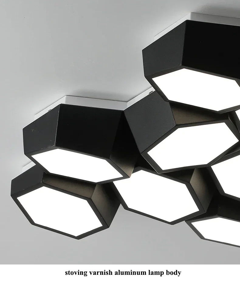 Modern ceiling light fixture with geometric design on a gray background