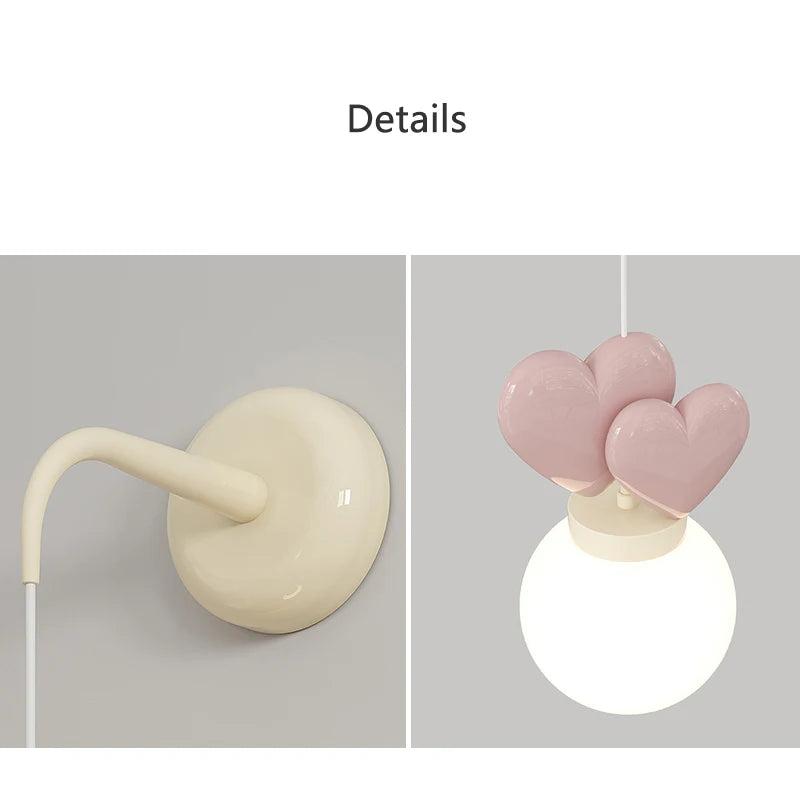 Wall hook with a pink heart-shaped light fixture on a gray background