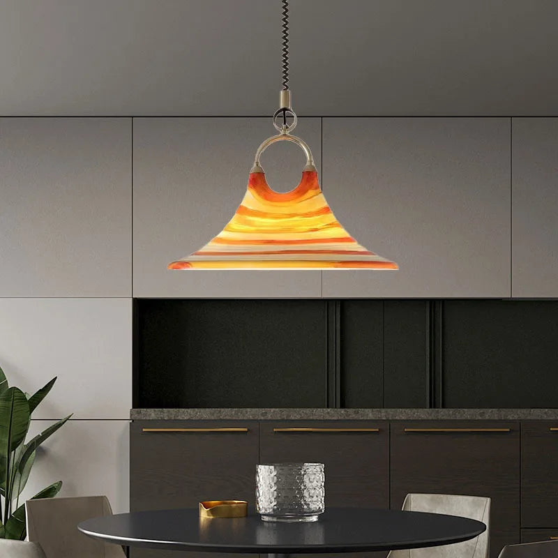  Stylish modern acrylic pendant chandelier suspended above a kitchen table