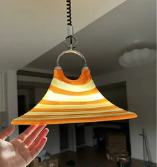 Retro trumpet shape LED lamp placed in a contemporary bedroom