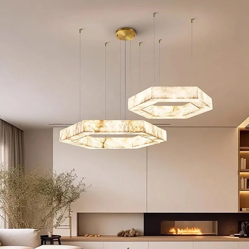 Three-ring marble pendant chandelier hanging in a modern living room
