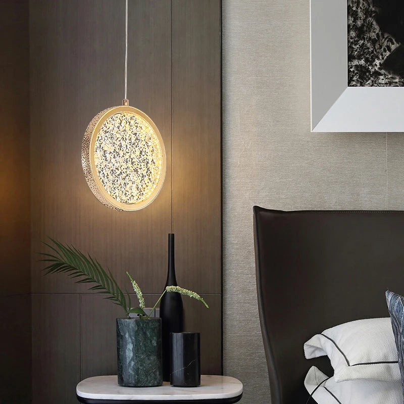 Cord pendant light with textured relief design and included LED bulb for bedside use
