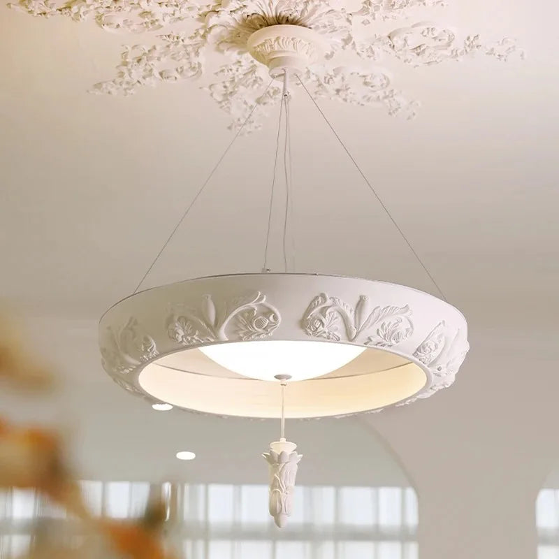 “Artistic carved plaster chandelier with resin detail”