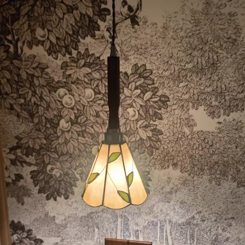 “Brass accent tiffany pendant light with walnut wood and colored shade”