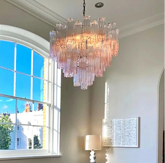 Semiflush mount clear glass LED chandelier illuminating cozy restaurant ceiling