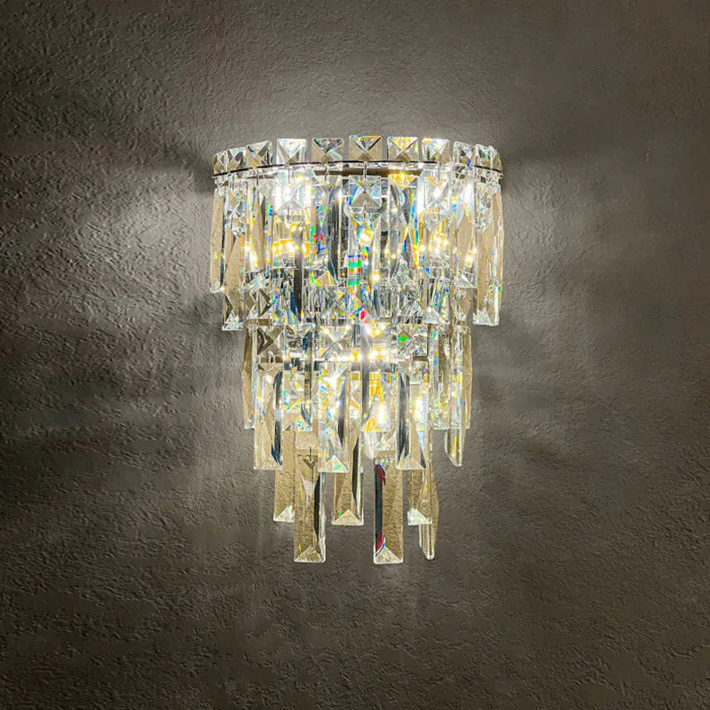 Crystal wall light fixture on a dark textured wall