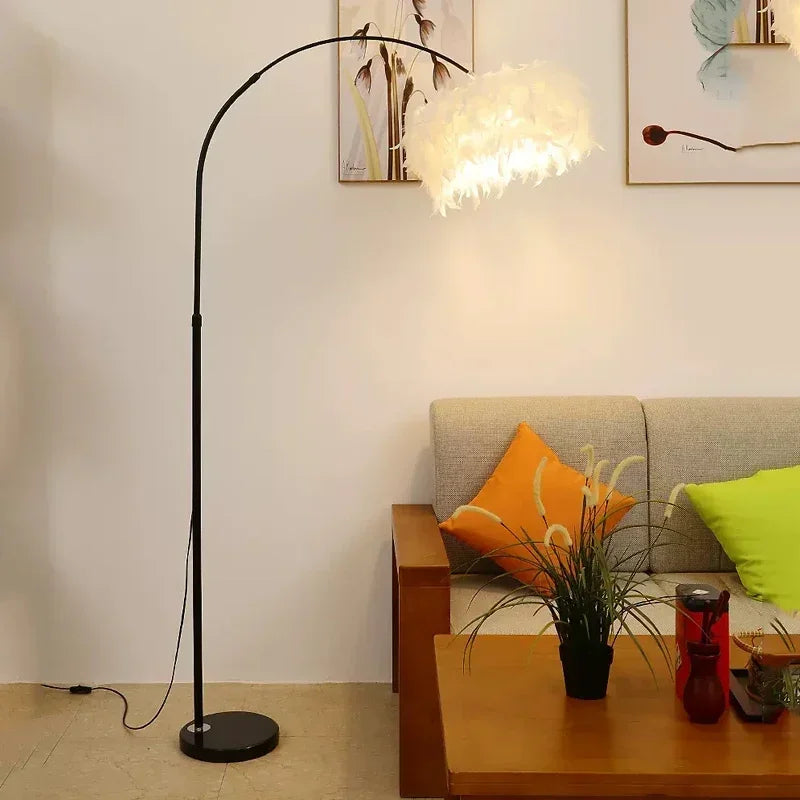 Creative feather reading and an ambient lamp for the bedroom. Living room with a floor lamp, sofa, and coffee table.
